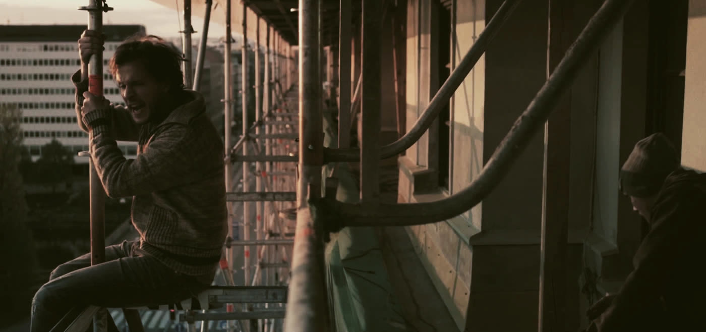 A man on scaffolding in the evening. Scene from Kilimanjaro.